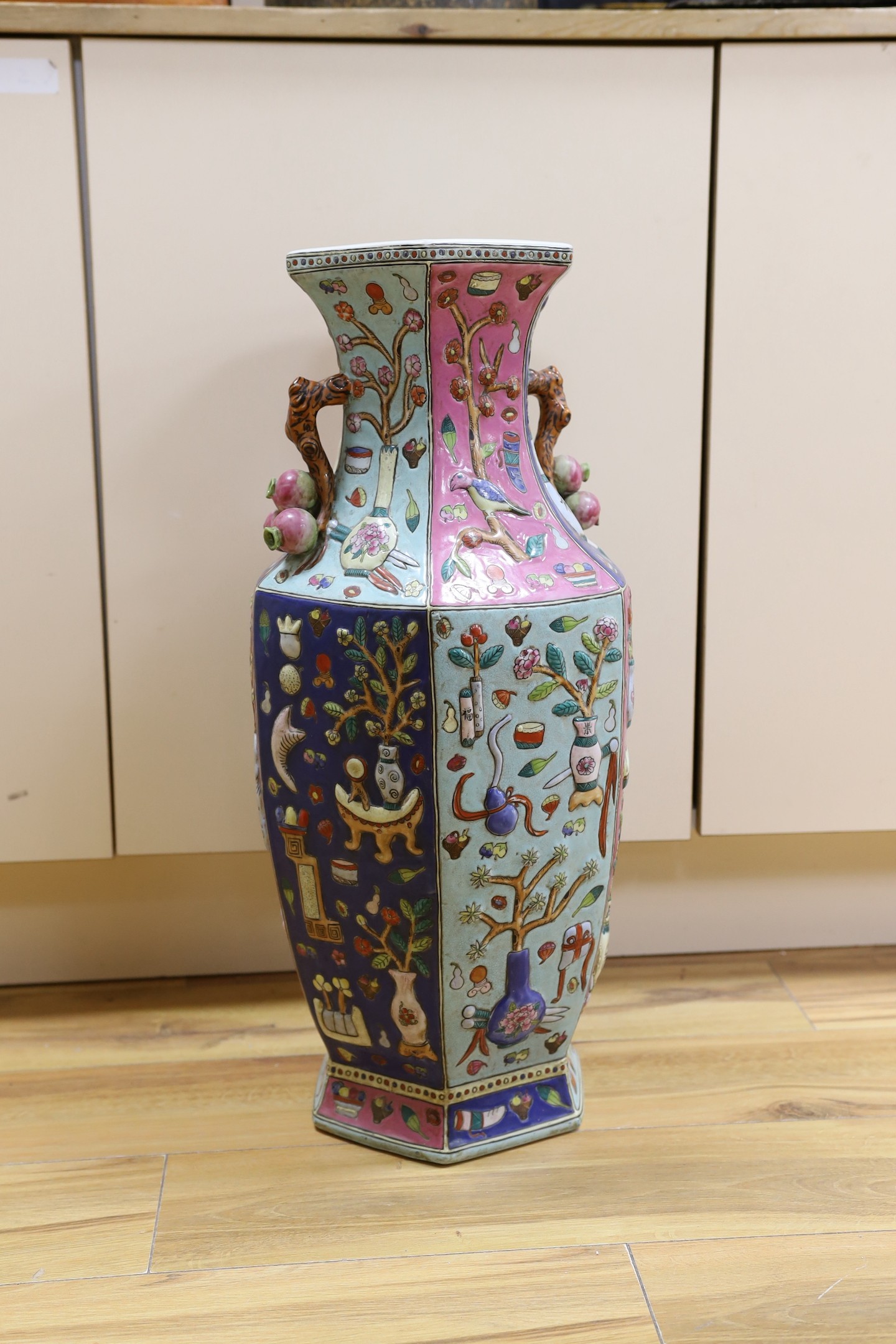 A large Chinese famille rose two handled hexagonal vase. 64cm tall